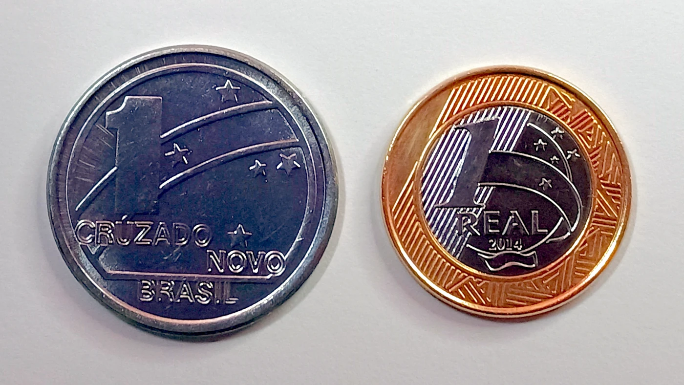 A Grande Mentira da Escassez Porque a moeda de 1 Real 2014 Vale Mais que a de 1 Cruzado Novo de 1989